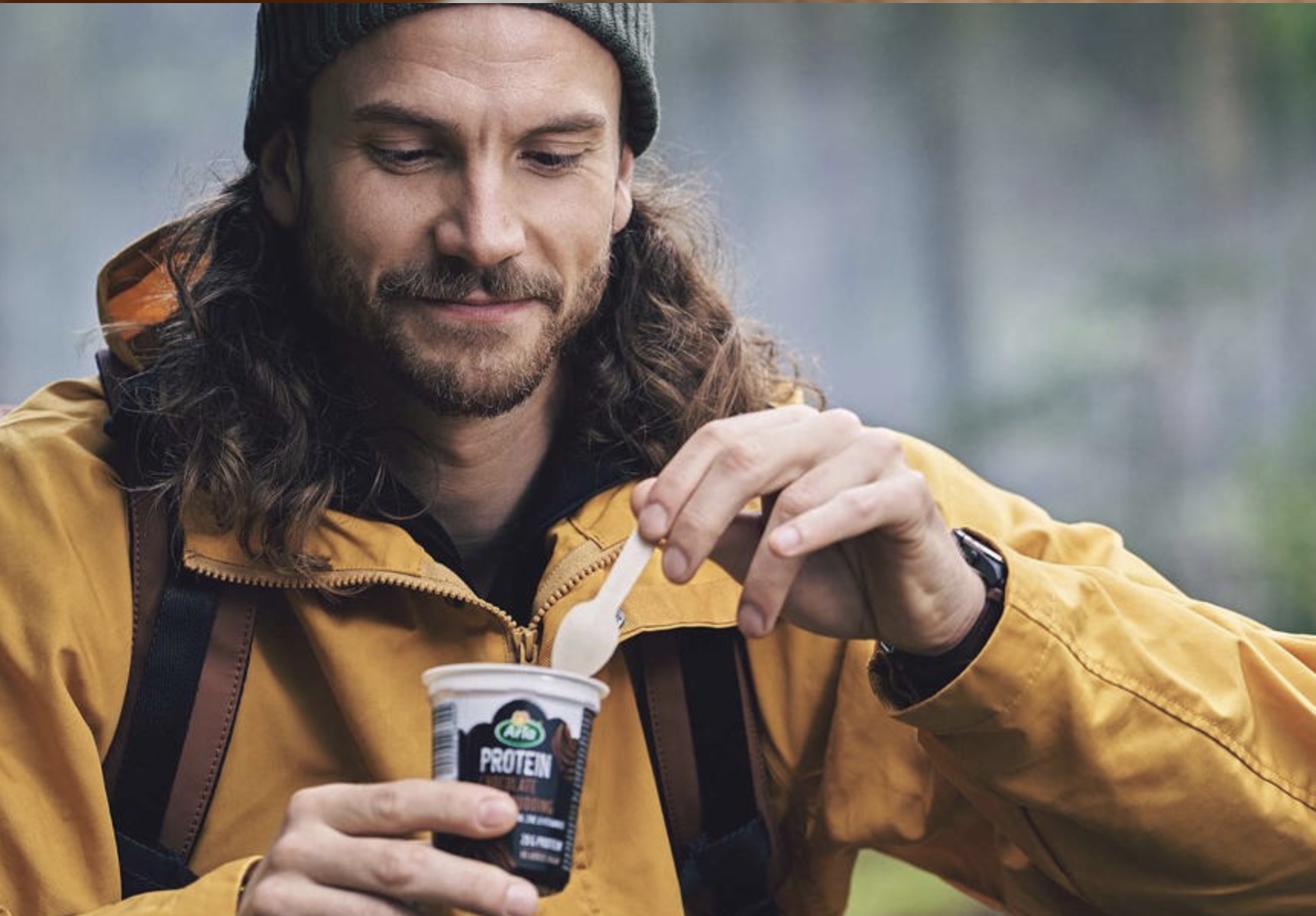 man eating protein pudding